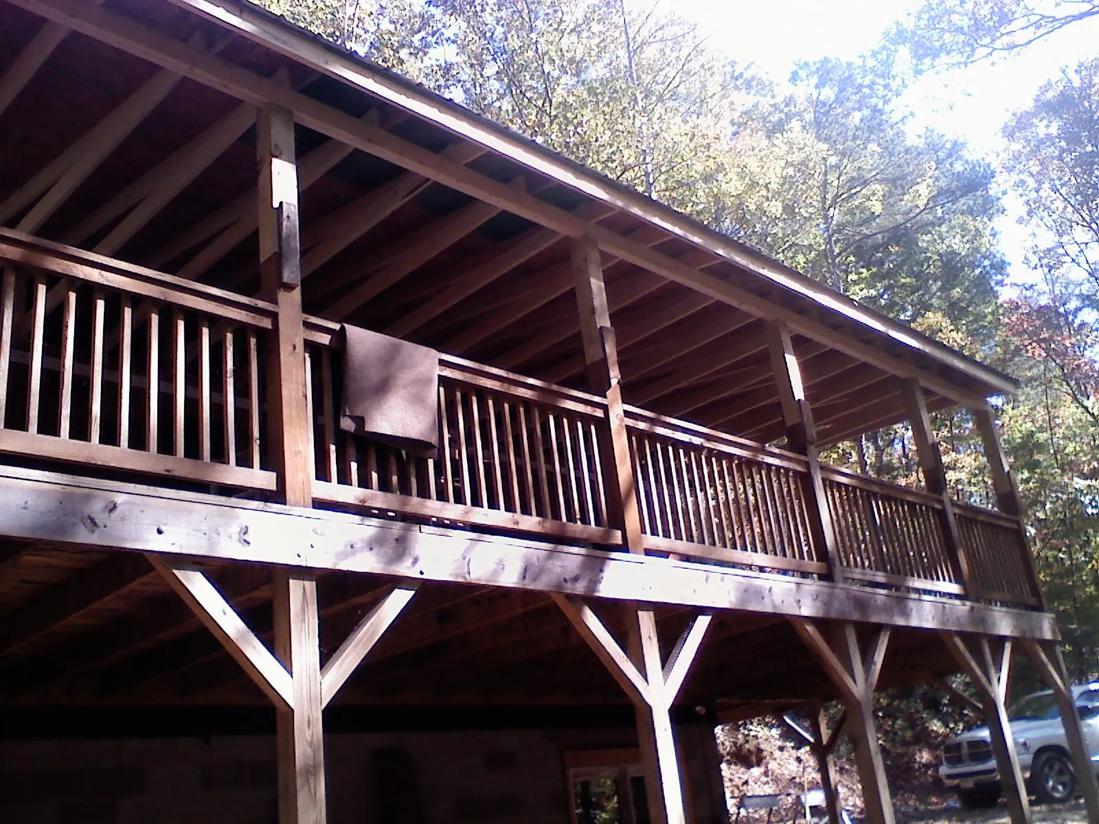 Timber framing under a new elevated porch and deck — Roof Leak Repair in White Pine by Roofing Brothers